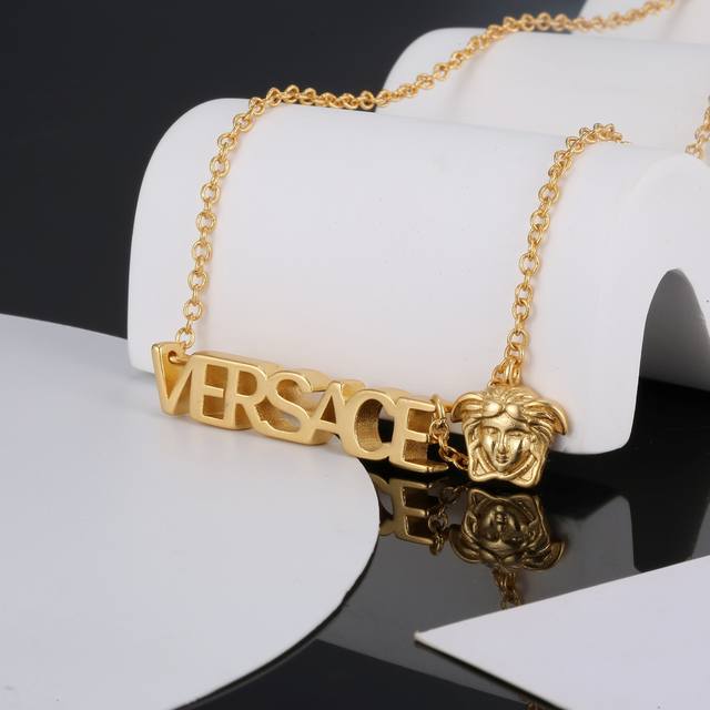 This Versace gold necklace is an elegant accessory, featuring a Medusa head and