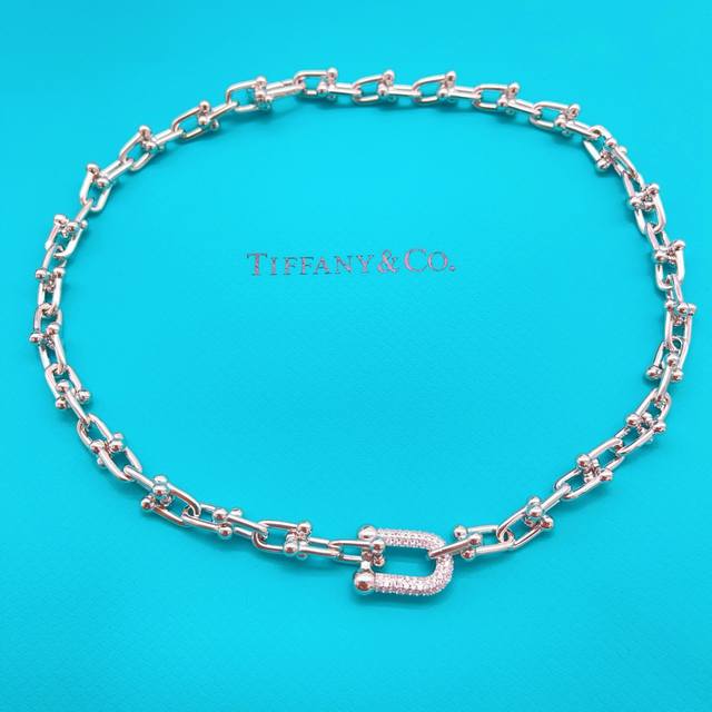 p90 Tiffany's latest silver diamond-encrusted horseshoe necklace, made of the sa