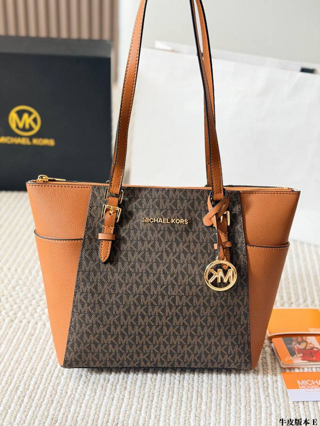 Cowhide version p260 Mk Jet Set Travel Tote Bag. Made of classic monogram PVC ma Cowhide version p260 Mk Jet Set Travel Tote Bag. Made of classic monogram PVC ma