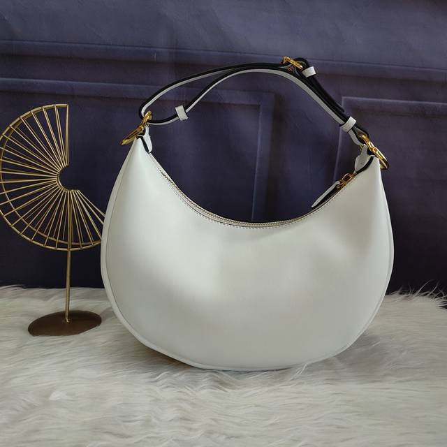 310 Style No. 8Br798 Crescent Bag, white. Made of soft white leather, the vintag