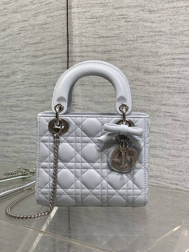 p910 Glacier Blue, in stock. Classic Lady bag with a bow and diamond clasp, a mu